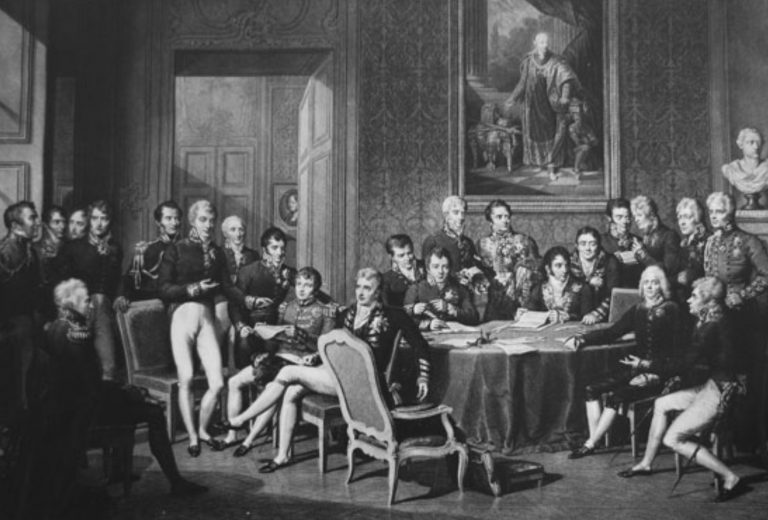 Delegierte des Wiener Kongresses, zeitgenössischer Kupferstich von Jean Godefroy nach einem Gemälde von Jean-Baptiste Isabey. In der linken Bildhälfte im Vordergrund stehend: Fürst Klemens Wenzel von Metternich.